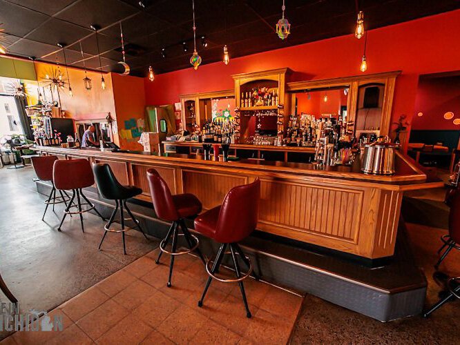 The seating in the bar and dining room is an eclectic mix of mismatched chairs.