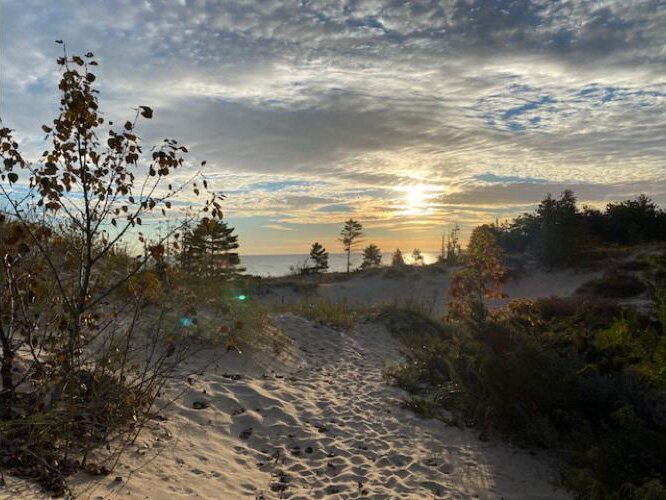 “The Recreation Passport is a tremendous value providing annual access to state parks, boating access sites, state forest campgrounds and more, all for $14,” says DNR Director Scott Bowen. Pictured here is the beach at Hoeft State Park on Lake Huron.