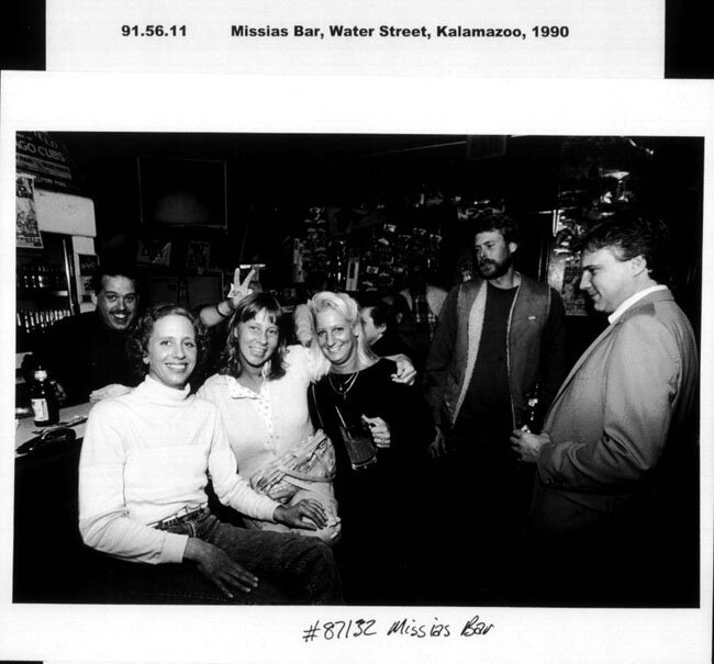 1990 photo of Missias from the Kalamazoo Public Library local history department. Bartender Al Yucker (left) with unknown patrons.