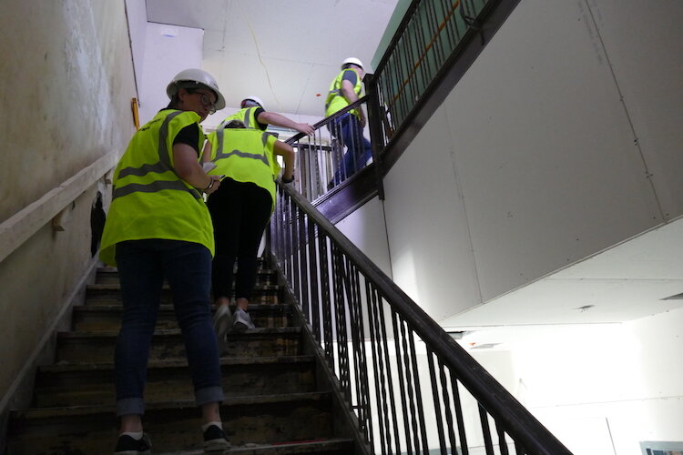 Traveling up the stairs in The Milton as renovations take place.