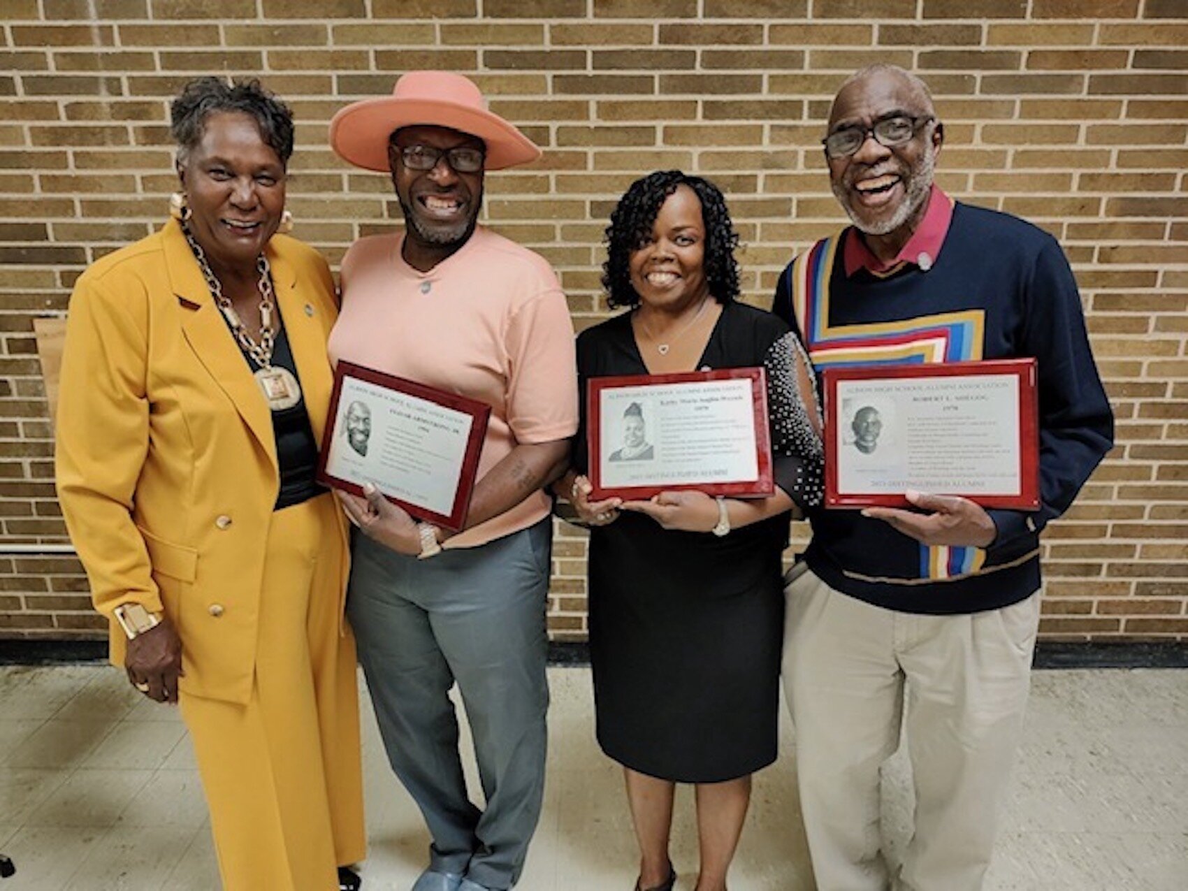 Robert Shegog (right) has received many awards for his wrestling and coaching career.