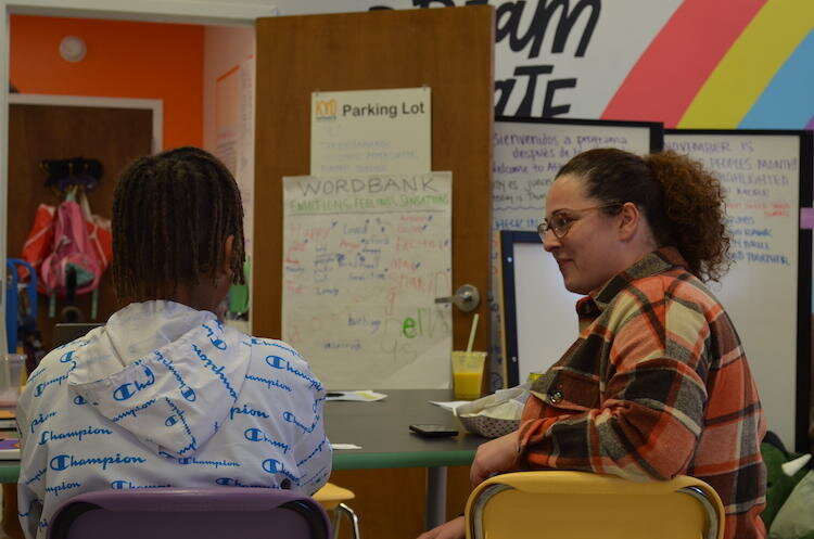 The group splits into pairs to brainstorm business ideas as a part of an exercise at the event. 