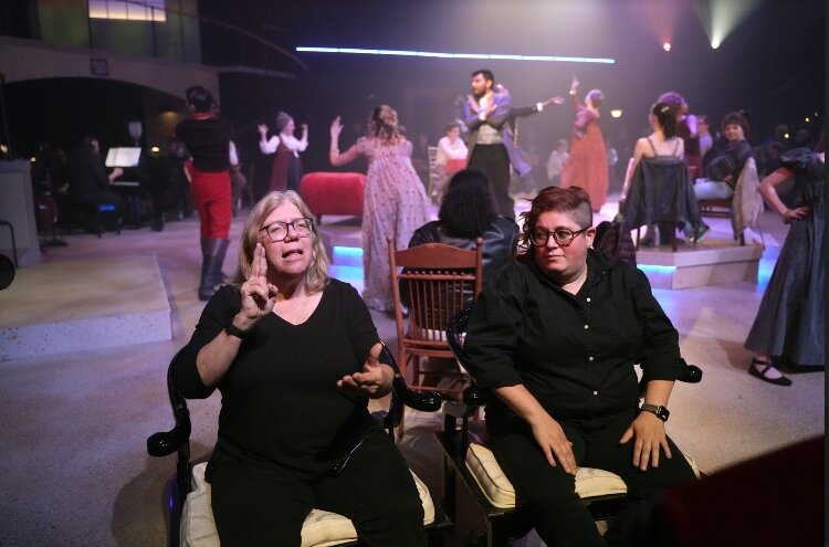 ASL interpreters sign at WMU Theatre production.