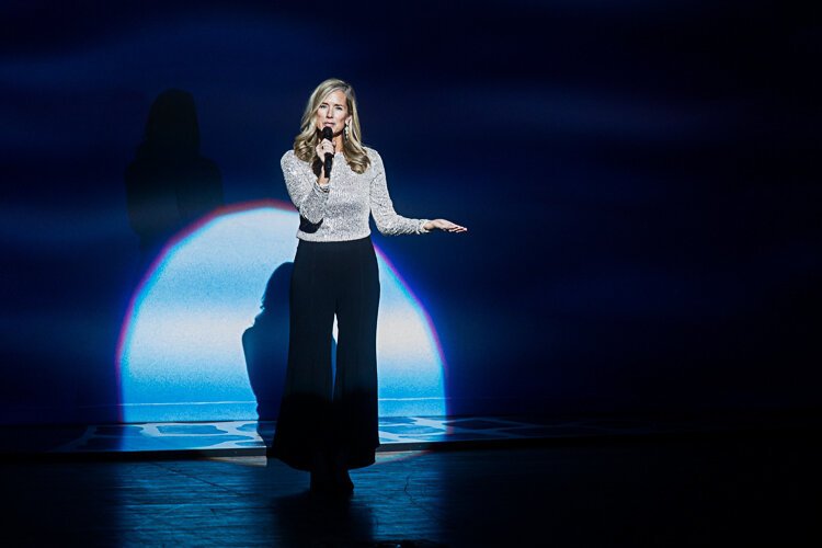 Meghan Distel welcomes patrons at the start of a Broadway Grand Rapids to the show.