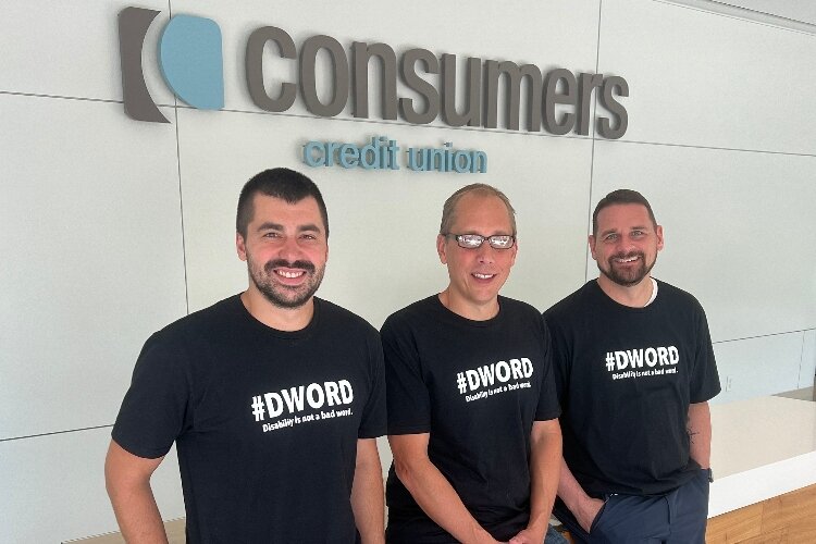 Picture shows three men wearing black shirts with the message "#Dword Disability is not a bad word."