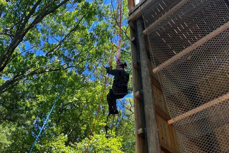 Jeff VanDyke tries out the adaptive rock climbing wall at Muskegon Luge and Adventure Sports Park.