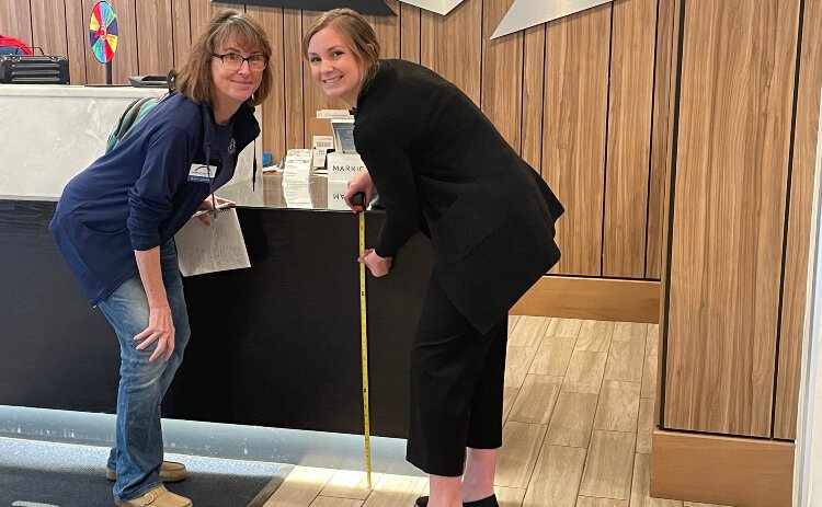 (From left) Disability Network Southwest Michigan's Kelly Linton, an ADA specialist and systems advocate working with Wheel the World, poses in the lobby of the Delta Hotel with Delta Sales Manager Ericka Regner.