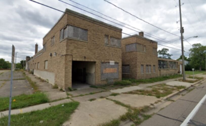 Picture of an abandoned factory also sitting on W. Van Buren St., across from abandoned business..