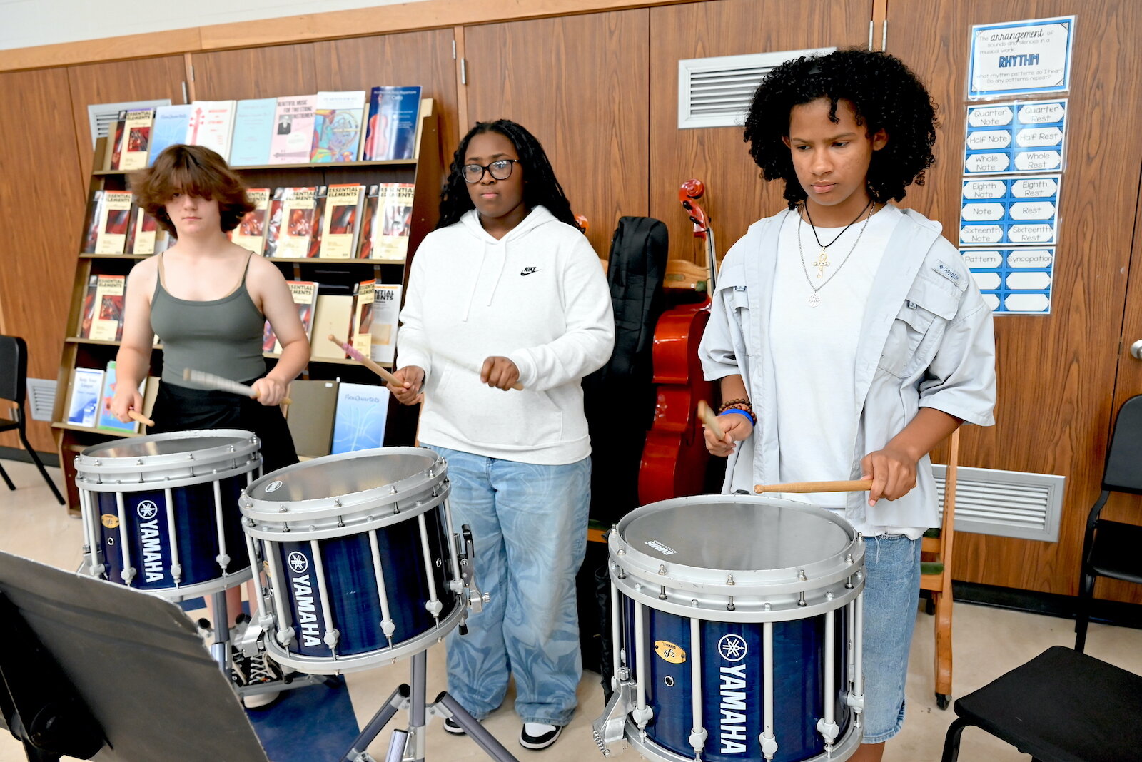 Practicing drums for Battle Creek Central’s band are, from left, Makayla Soler, Chynia McCreary, and Jania West.