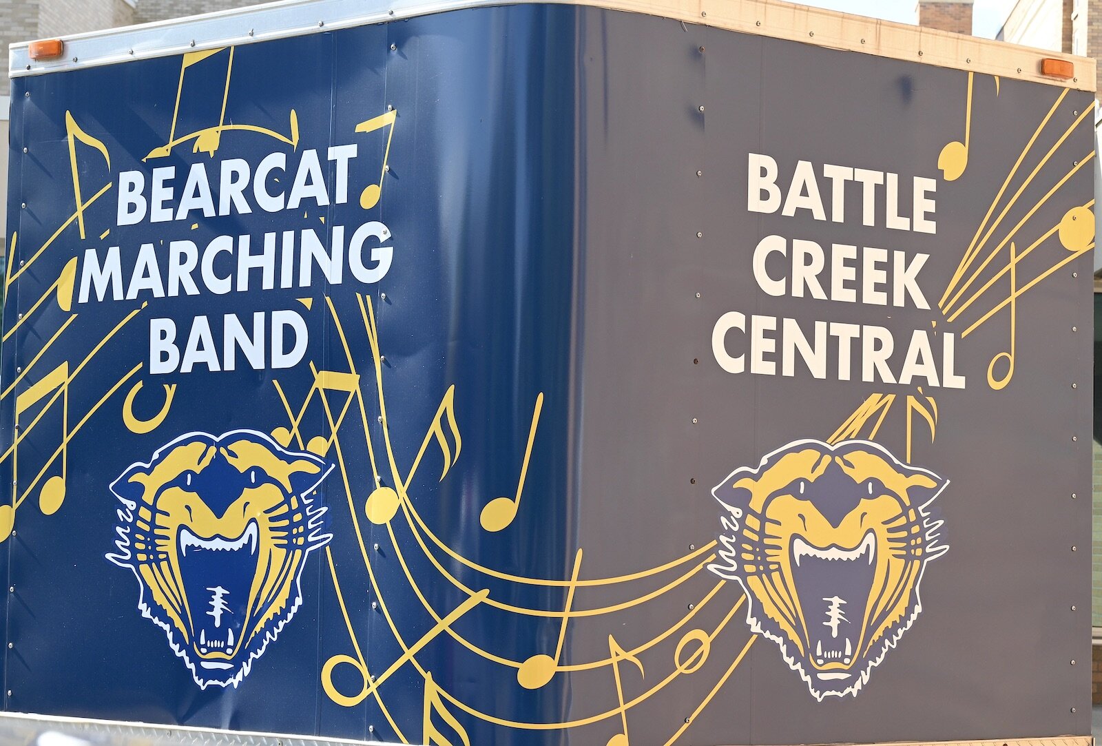 Battle Creek Central High School’s marching band trailer is parked outside the high school.