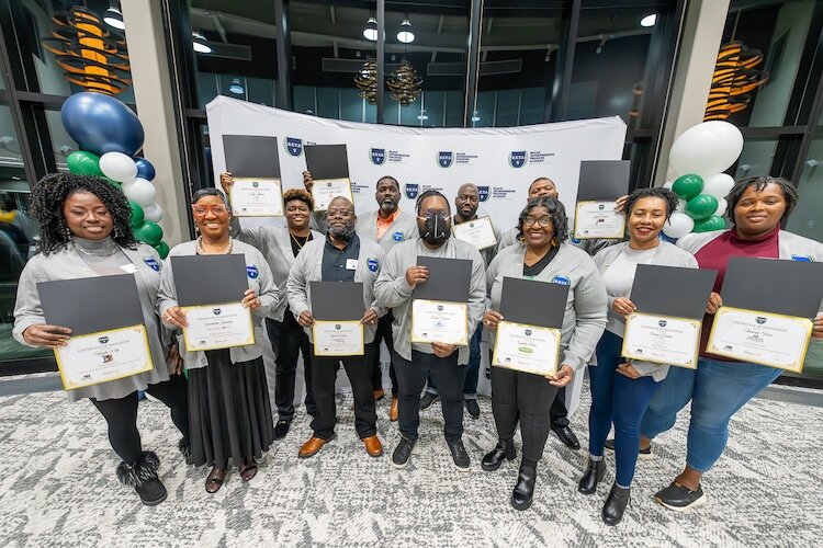  BETA graduates displaying certificates of completion. From left: Tanisha Pyron-Clay, Gwendolyn Jennings, Daja Johnson, Lyonel LaGrone II, Matzateil Yahudah, Michael Budram, Soulely Saddy, Cynthia Hines, Jeffrey Oconner, Carrie Dennie, Vanessa Frias.