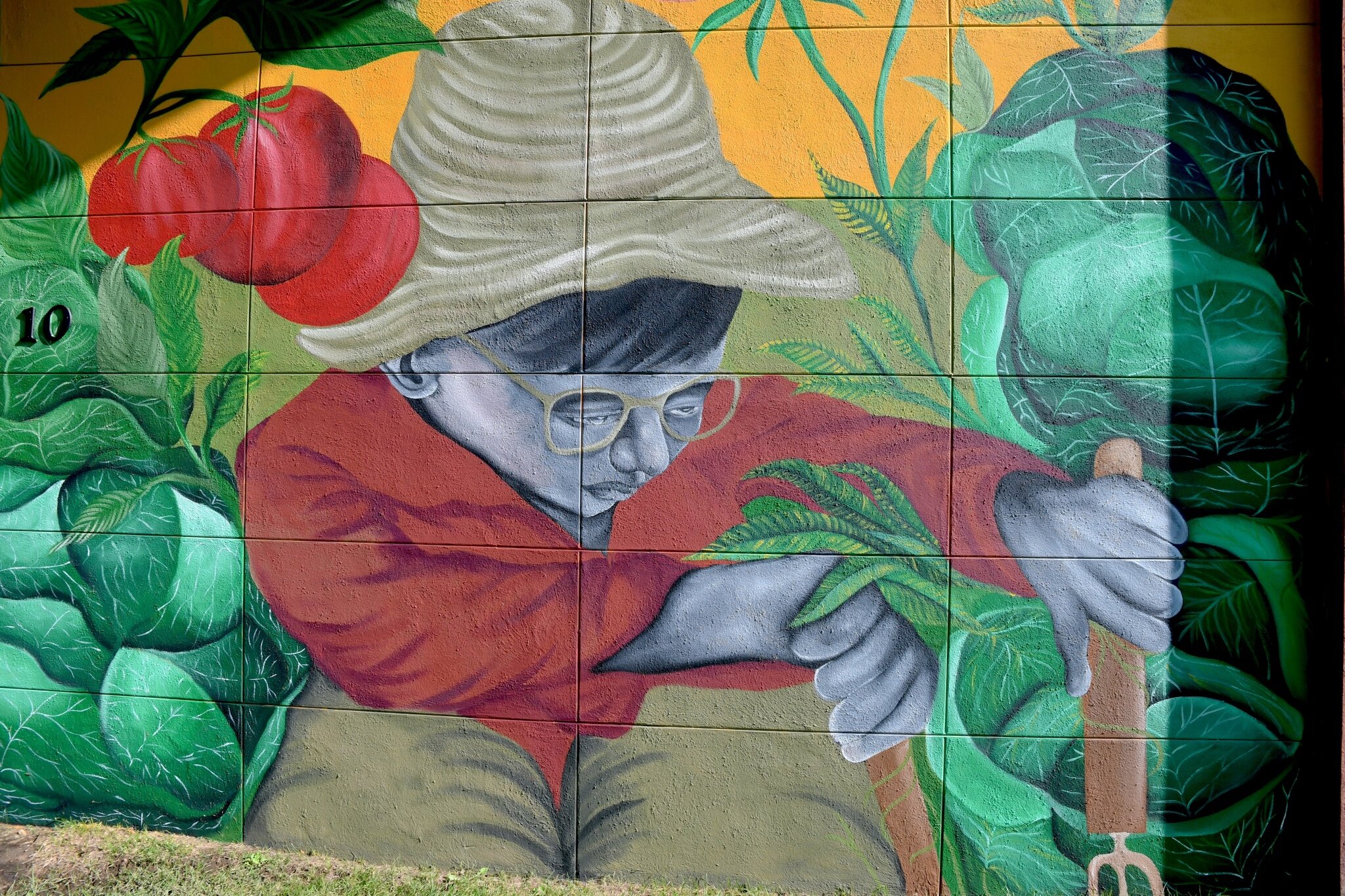 Close up scenes of Jamari Taylor’s mural on one of the walls of Trinity Neighborhood Center