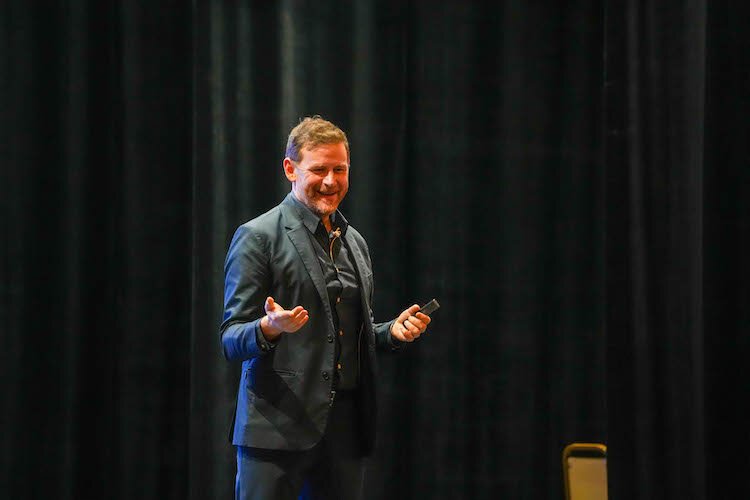 Charles Montgomery, author of "Happy Cities," speaks to a Kalamazoo audience on Friday, Jan. 31, 2025.