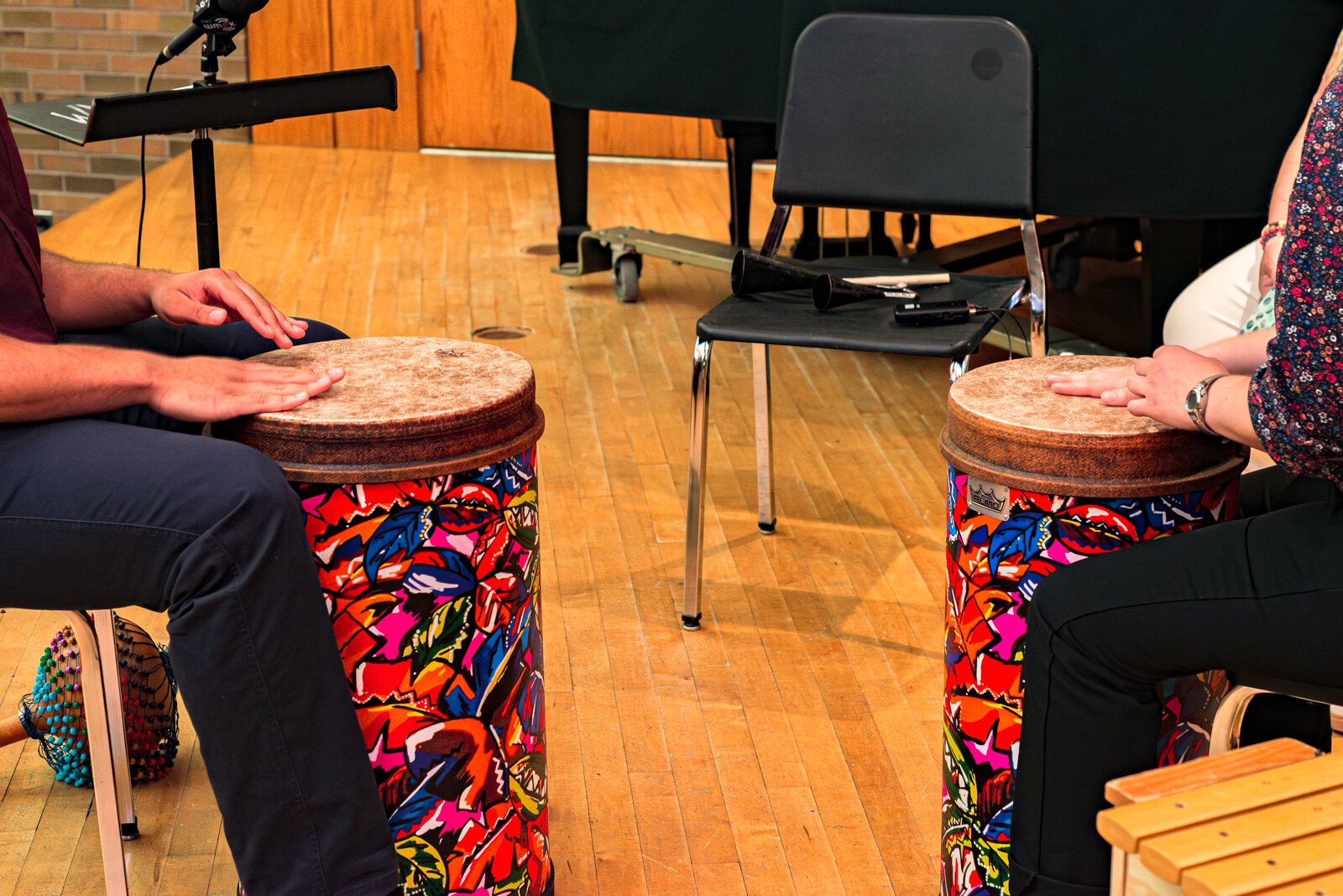 Phoebe Ryckbost, and Thomas Valentine, both undergrad students in the WMU music therapy program demonstrate a rhythm-copying activity.