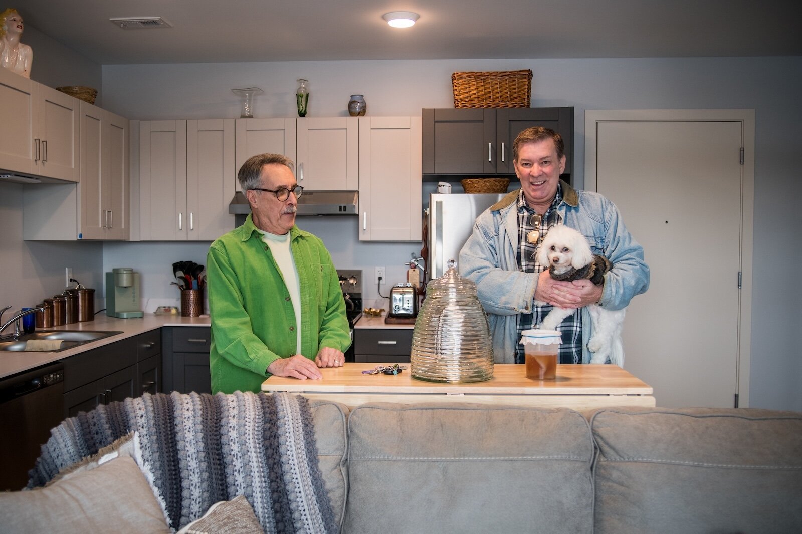 Paul Smith, Larry Gorham and their little dog Riley were the first to move into 530 Rose Place.