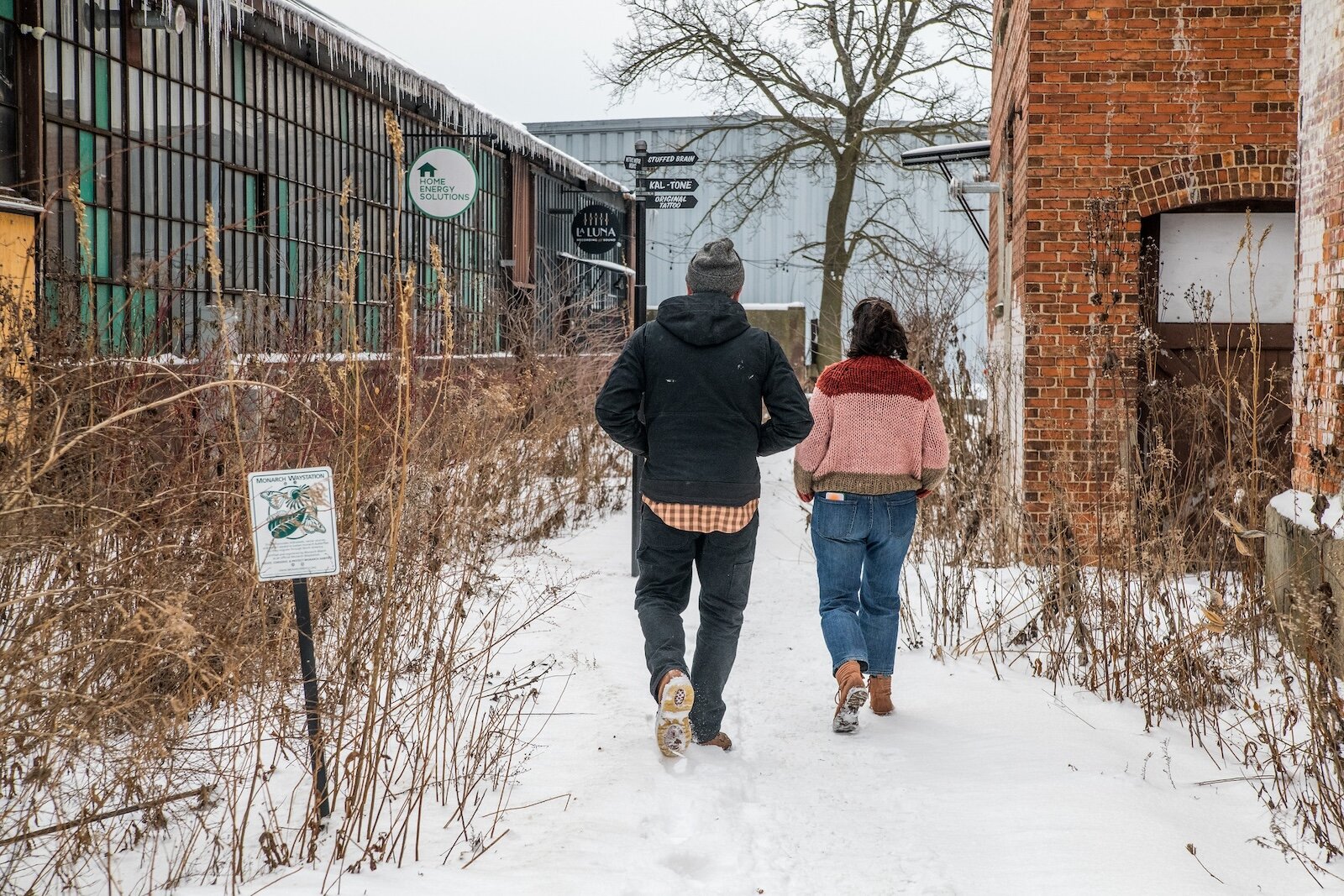 Jeb and Krystal Gast walk between the buildings of Jerico have taken old industrial buildings that they have turned into a hub of small business activity.