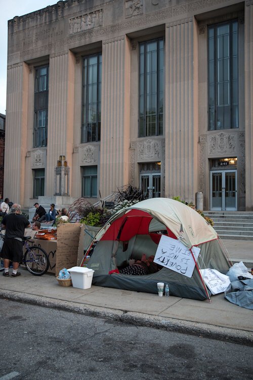 Homeless individuals invited people to talk to them during their encampment in downtown Kalamazoo in 2018.