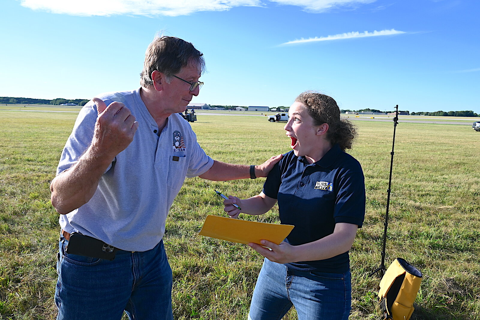 Pat Rolfe asks Katie Nickolaou if she wants to ride in his balloon.