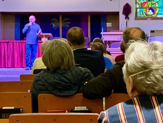 Chad Hoke, president of the Milwood Neighborhood Watch Association, speaks at the association's first in-person community meeting since early 2020. The meeting was held on Tuesday evening (March 22, 2022) at the Milwood United Methodist Church.