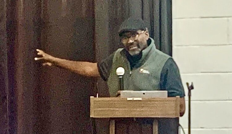 Nnamdi Dike, head of Finance & Budget for the Kalamazoo Public Library, speaks at the Oct. 29, 2024 town hall meeting at NACD.