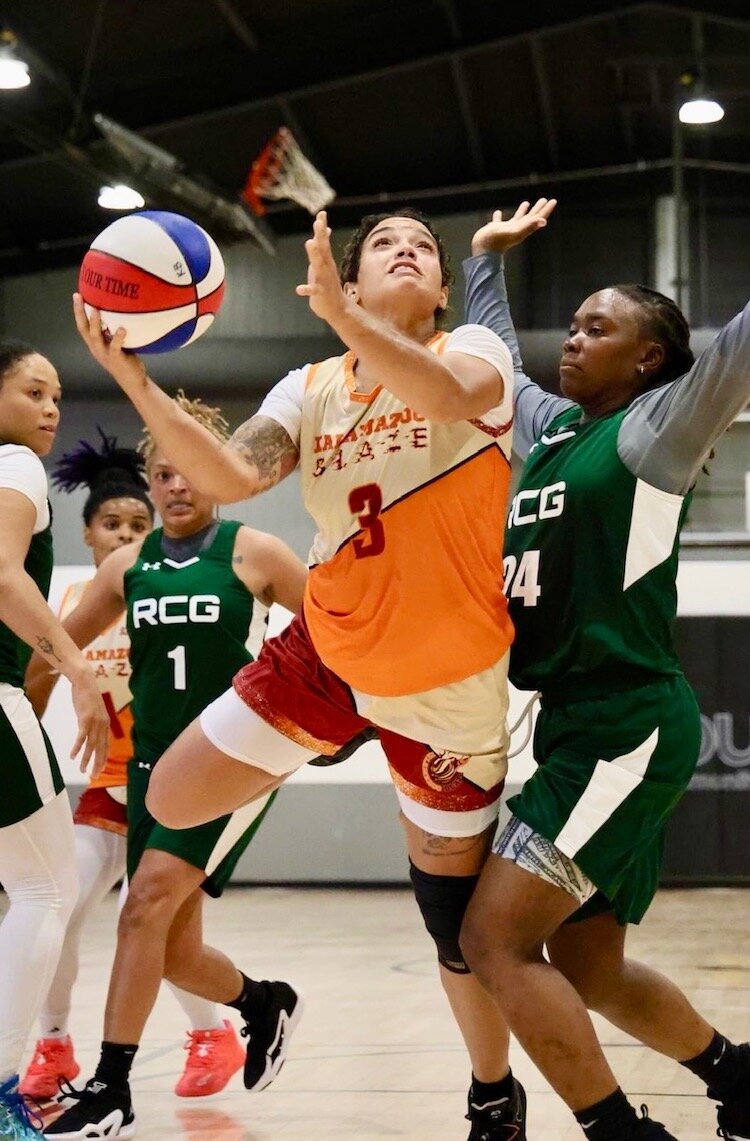 Sierra James, co-caption of the Kalamazoo Blaze, makes a move during a recent game played in the gymnasium of Kalamazoo’s Douglass Community Association.