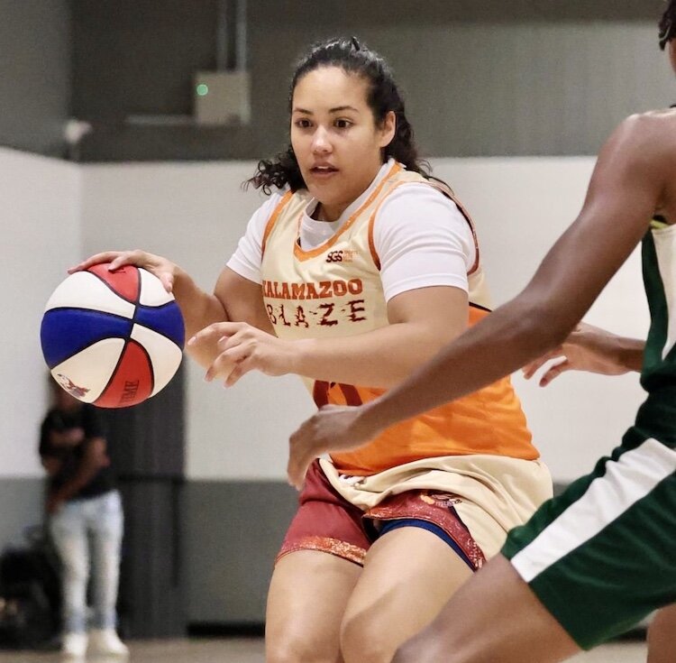 Brenda Davis, co-captain on the Kalamazoo Blaze, brings the ball upcourt during a recent game at the Douglass Community Association gymnasium.