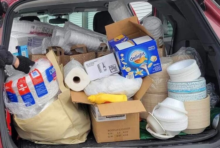 A car is shown packed with some of the supplies that will be necessary to help feed people at the Heads in Beds for Christmas.