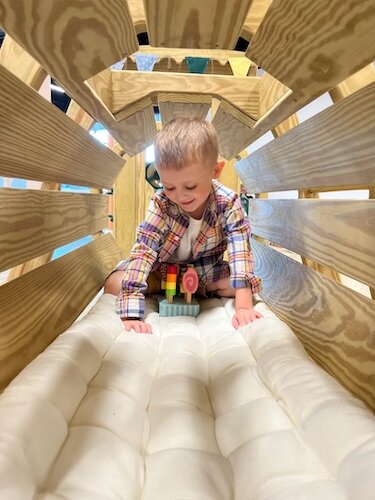 Brady crawling through the train tunnel. 