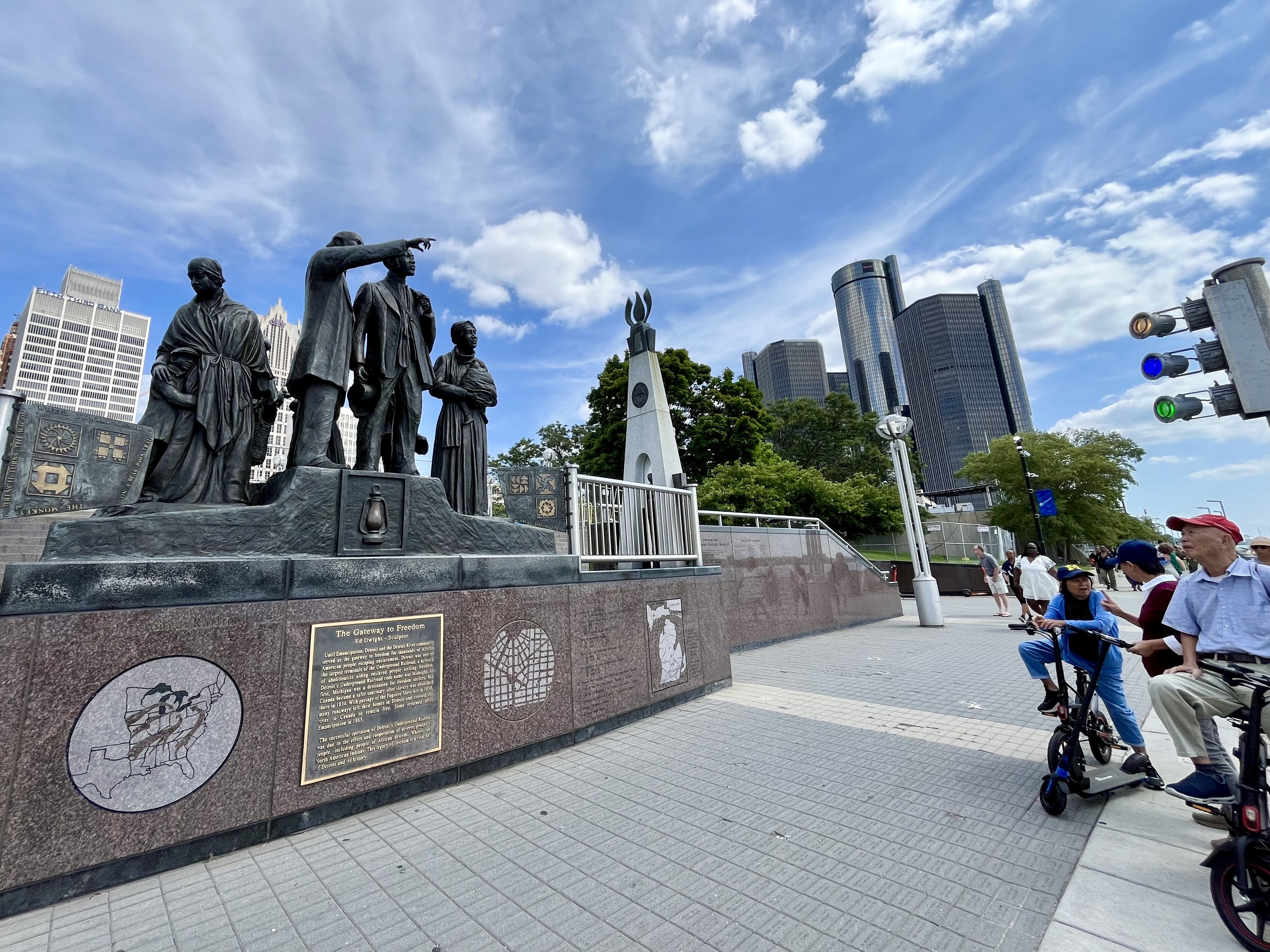 Tourists from the other side of the planet wonder at "The Gateway to Freedom" on Detroit's RiverWalk. 