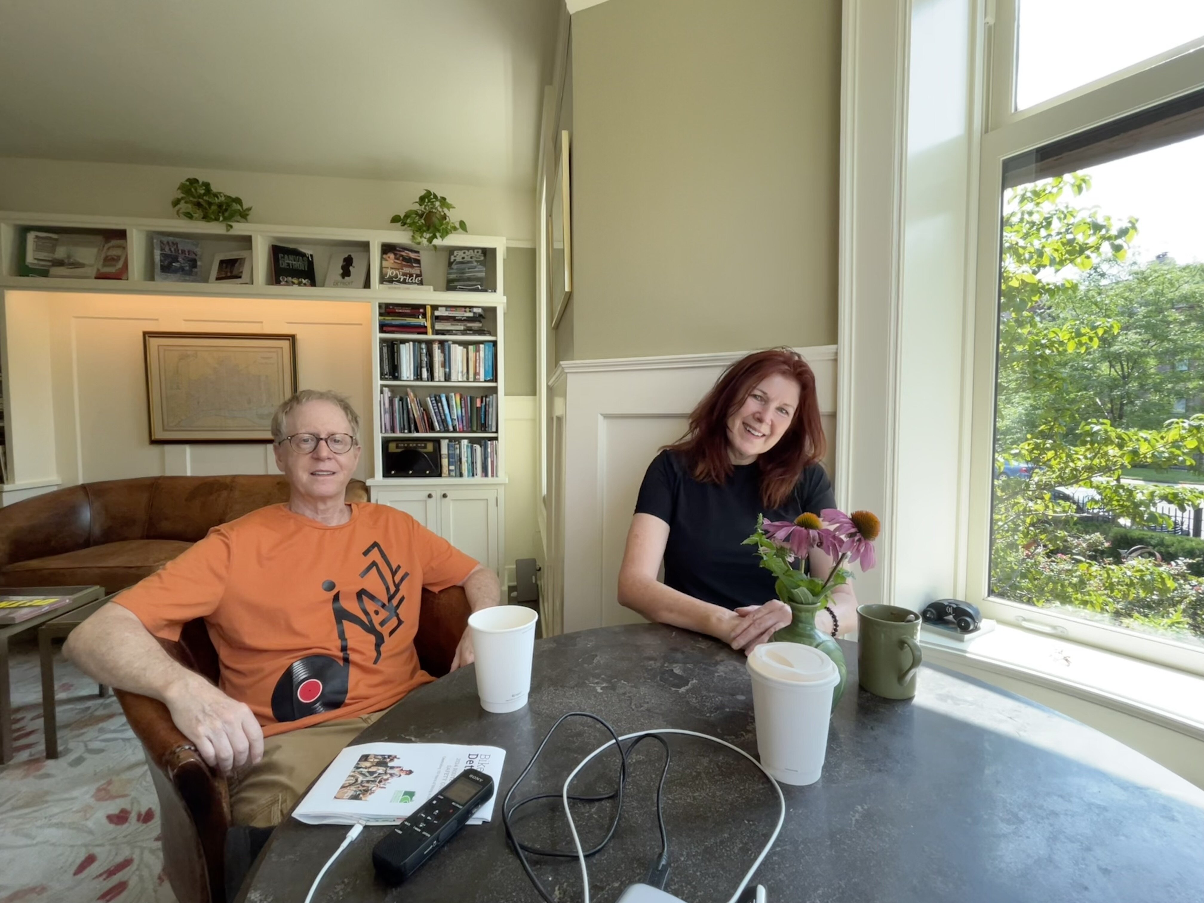 El Moore residents gather in the building's community parlor. Andy Ross and Megan Powers talk about bikes with the author.