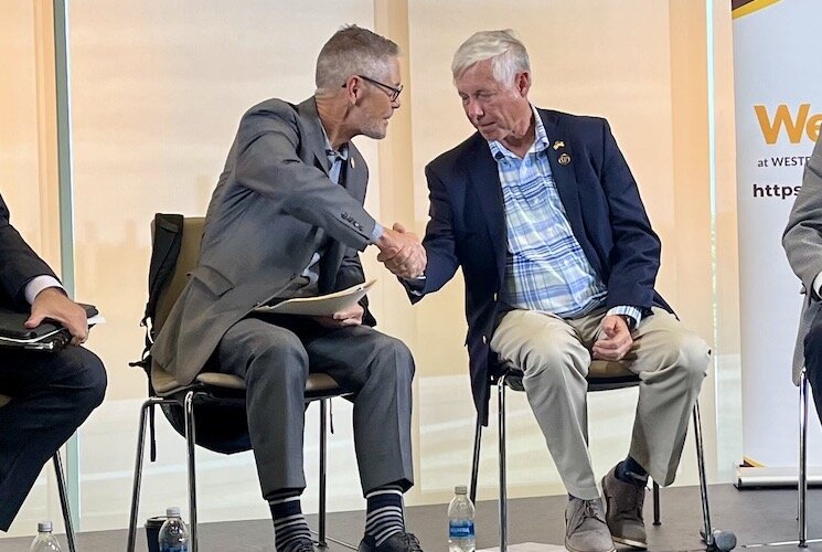 Retired U.S. Representative Mark Schauer (democrat) and Retired U.S. Representative Fred Upton shake hands at the Citizens Rising event.