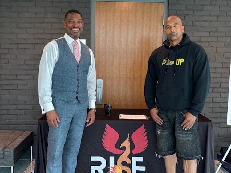 Damon Brown, President and CEO of R.I.S.E. Corp, stands with Rev. Dr. Starsky Wilson, President and CEO of the Children's Defense Fund