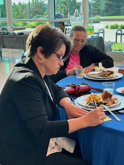 Mary Mulliett, President and CEO of the Battle Creek Community Foundation, foreground, and Jacqueline Patrick James, Director of R.I.S.E.'s Student Empowerment Program and Board Treasurer, giving written responses to questions.