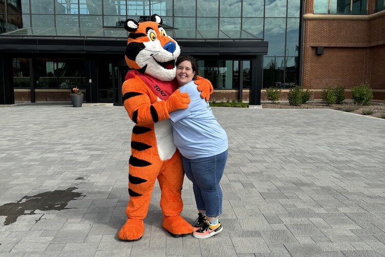 Robin Bolz hugs Tony the Tiger at this year's Cereal Fest.