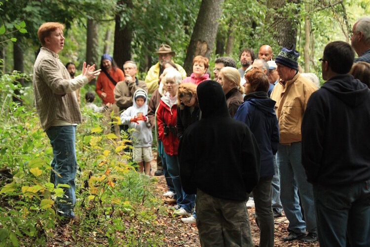 Nate Fuller leads a nature walk at Kleinstuck Preserve in Kalamazoo.