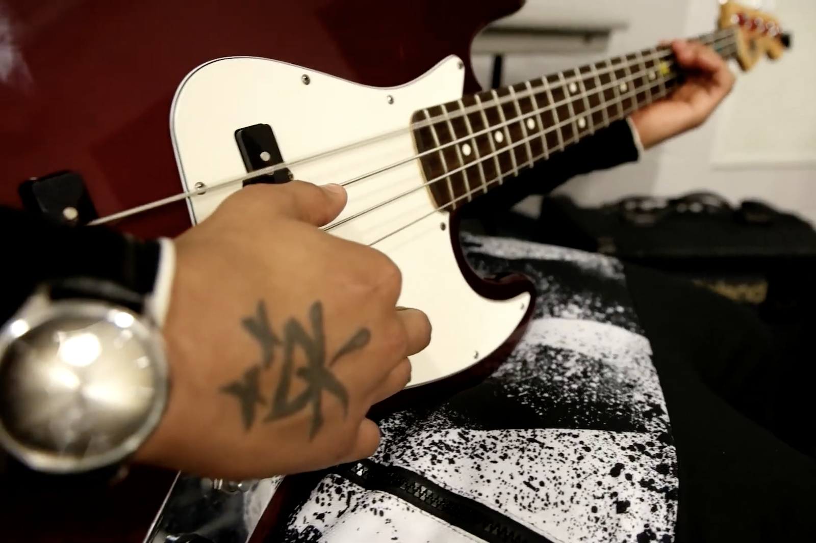 Under the guidance of music therapist Loie Morand, a teen plays an electric guitar during a group therapy session at the Kalamazoo County Juvenile Home.