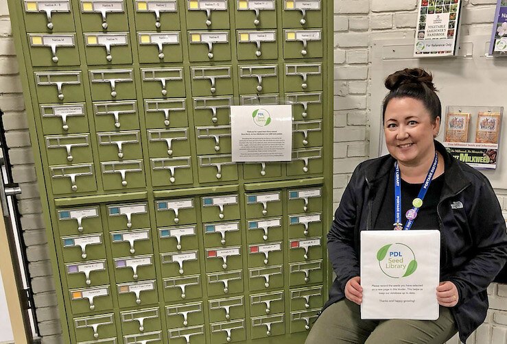 Quyen Edwards with the native-seed library at the Portage District Library.