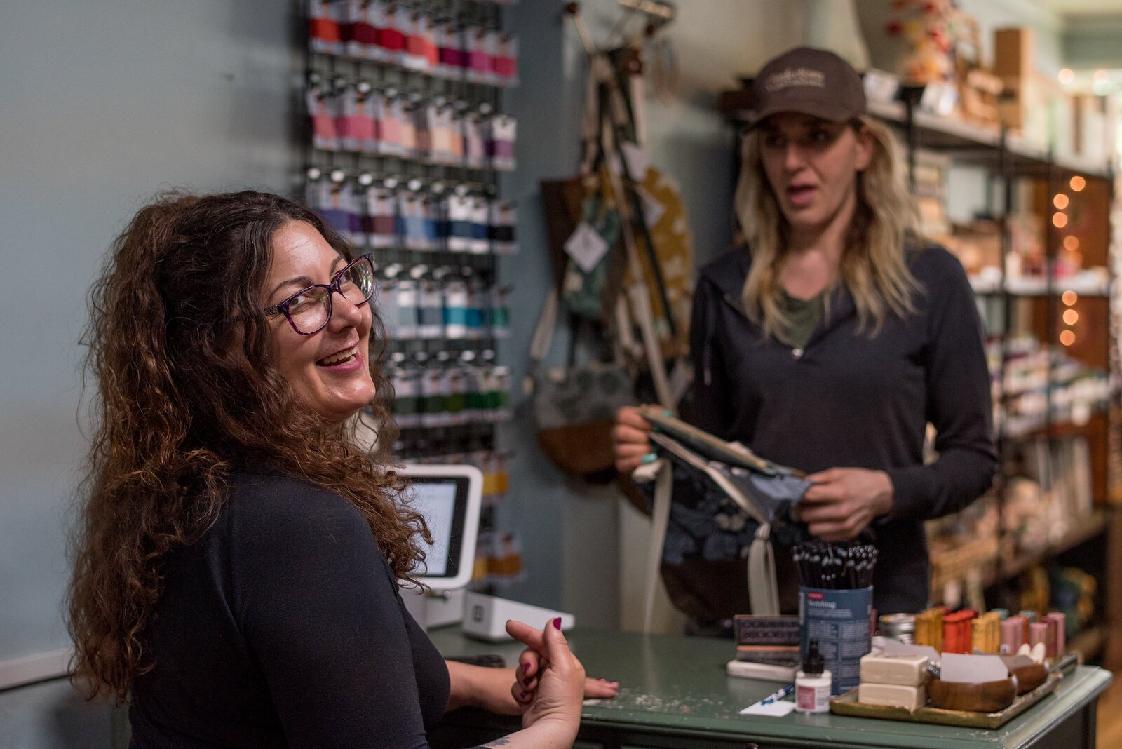 Rebecca Macleery, owner of Kalamazoo Dry Goods, and sister Jennifer Faketty, owner of Confections with Conviction, frequently visit  each other's stores.
