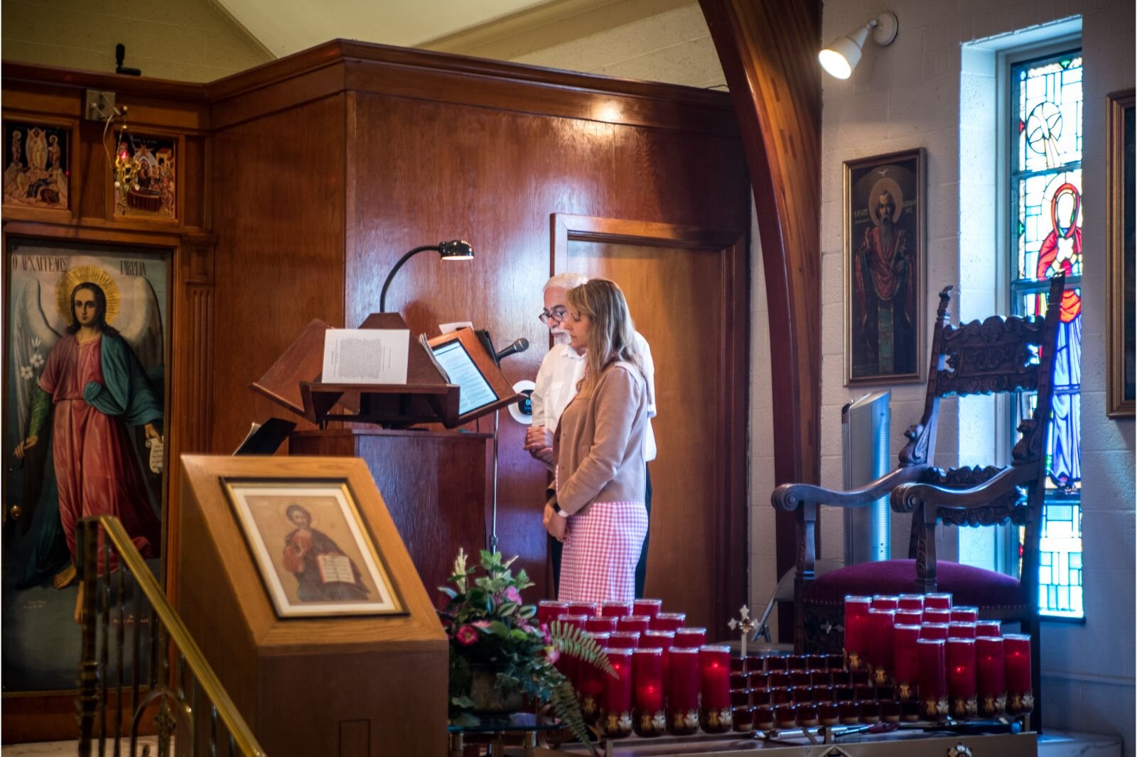 Chanters Elias Kokkinos and Dr. Alice Doe. Kokkinos has chanted for Annunciation for over 35 years, an expat Greek/ Byzantine chanter. Alice has recently stepped up to learn the intricacies of Byzantine chant.