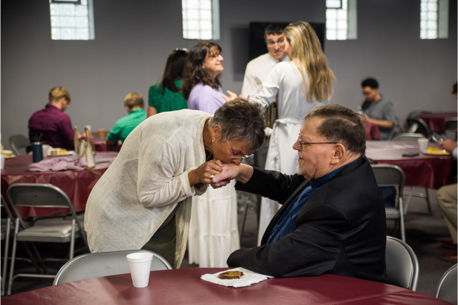 A parishioner with Fr. Theoharis Theoharis during after-church coffee time.