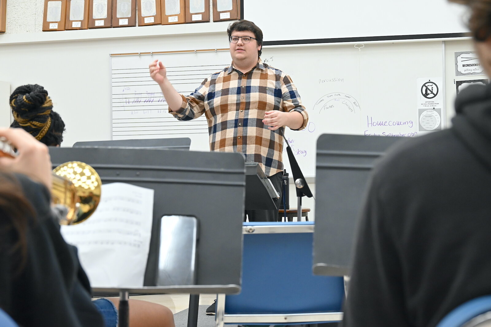 Fred Jankowski, Director of Bands at Battle Creek Central High School, works with students during a recent rehearsal.