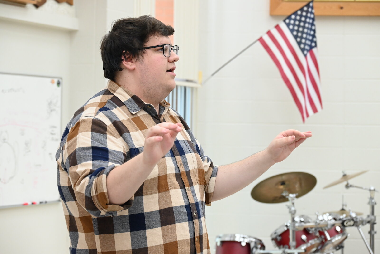 Fred Jankowski, Director of Bands at Battle Creek Central High School, works with students during a recent rehearsal.