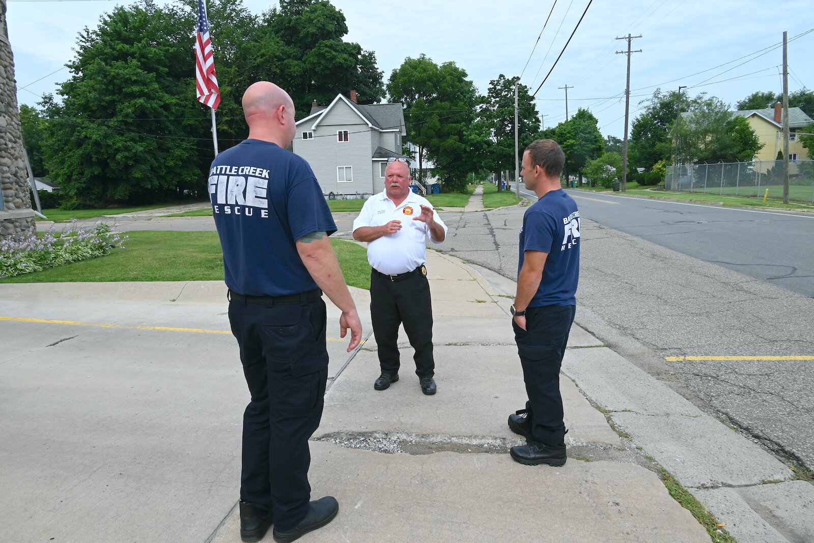 Battle Creek Fire Department Chief Bill Beaty, center, talks with firefighters, Kyle Williams, left, and Justin Holm, right, at Station #3.