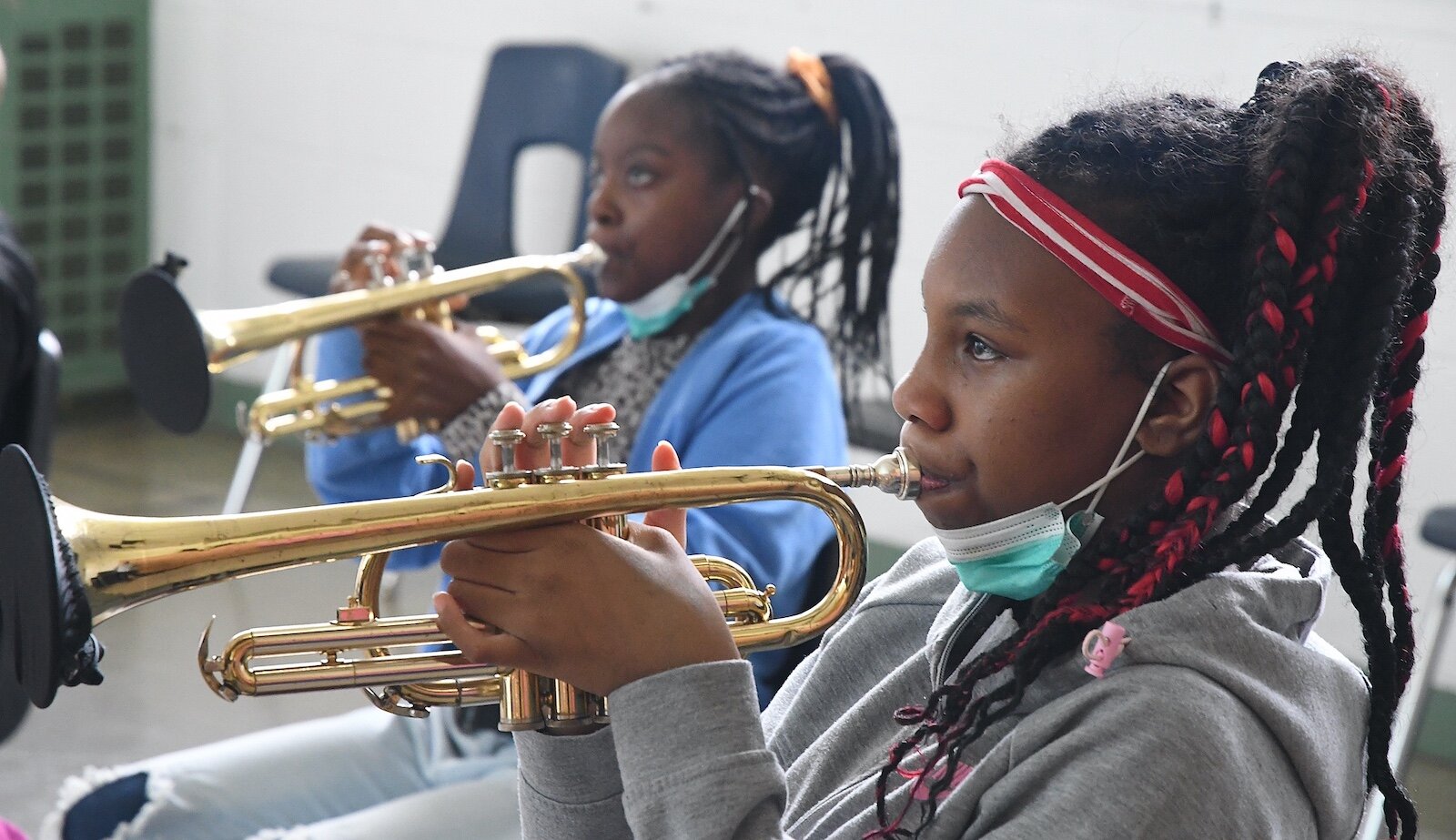 Sylvia West, left, and Kareana Osborne, sixth grade students at Northwestern Middle School, practice their trumpets in music class.