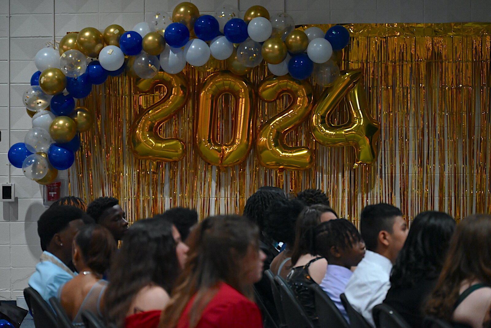 Some of the eighth grade graduates at Battle Creek Public School’s STEM Innovation Center listen to speakers during the graduation ceremony.