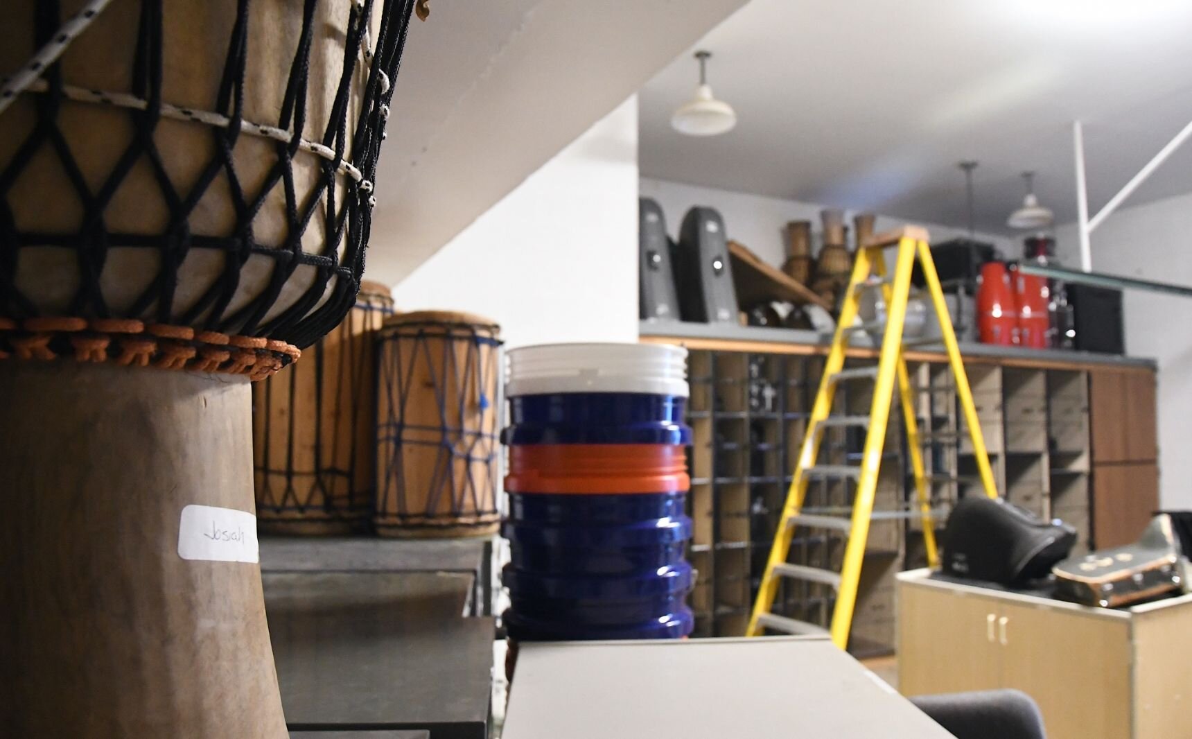 Drums in storage backstage at Northwestern Middle School’s audtiorium.