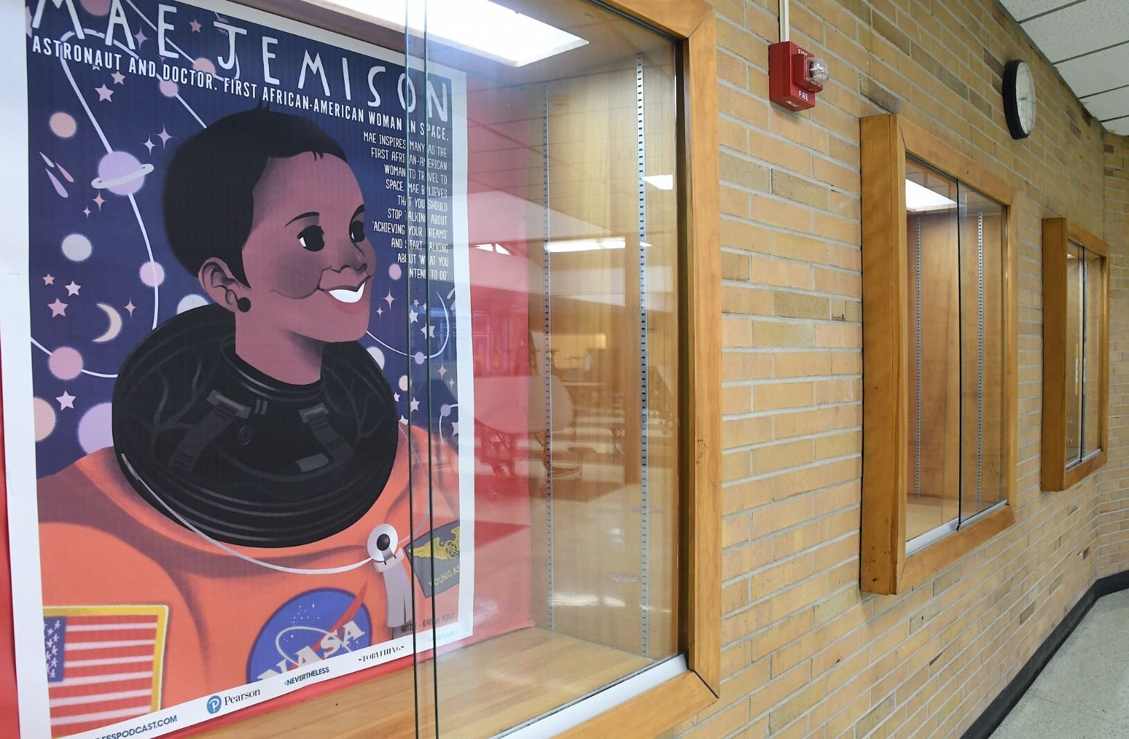 Display cases at Northwestern Middle School’s audtiorium show prominent role models.