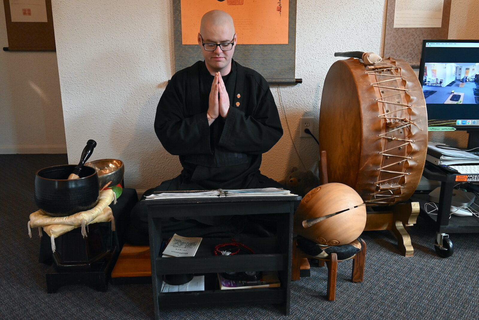 Shodo sits while offering prayers for the sick and suffering at the Buddhist Temple Monastery in Battle Creek.