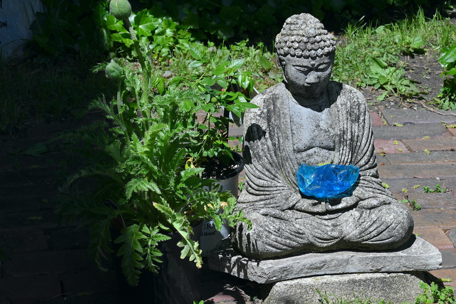 Statatues of the Buddha inside and outside the SokukoJi Buddhist Temple Monastery in Battle Creek.