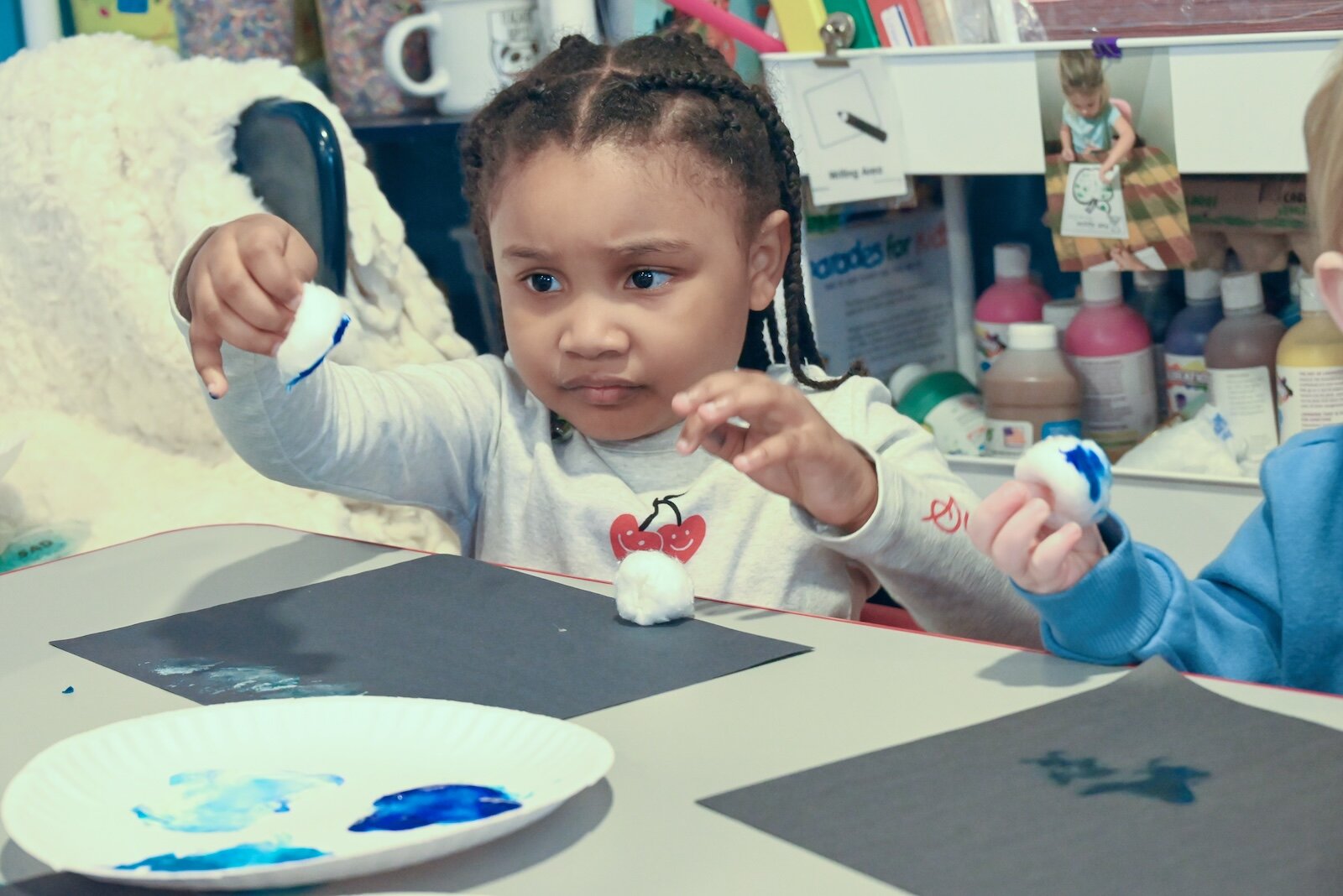 Anastasia Carter works on a winter picture at Kim’s Kiddie Korner Childcare.